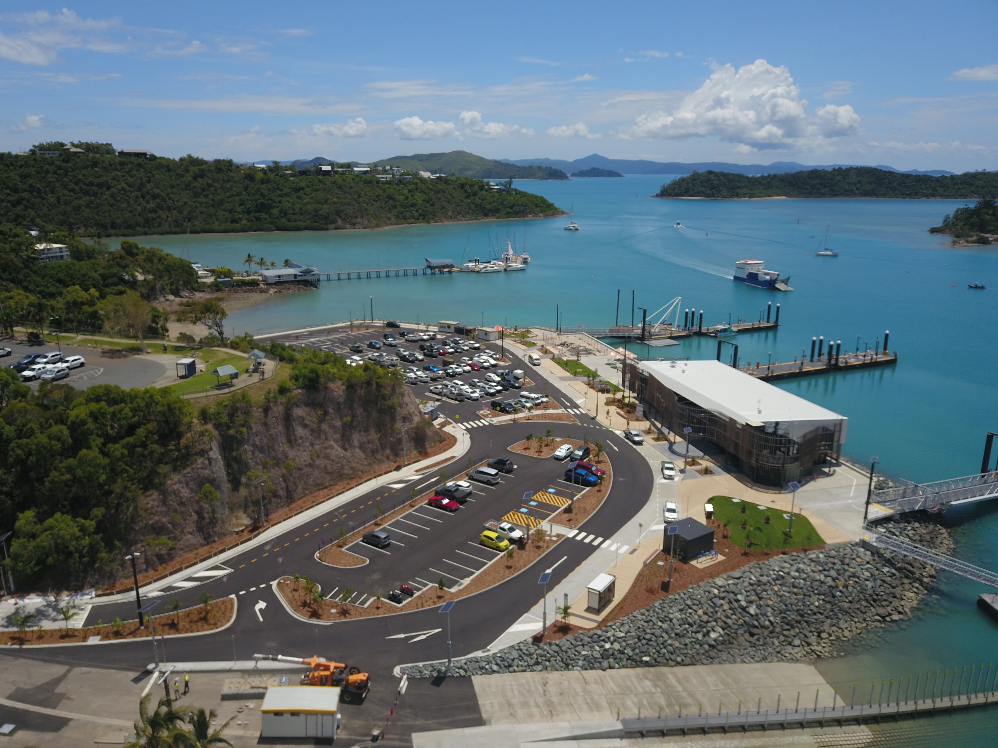 Aerial view of the redeveloped Shute Harbour terminal, car park, seawall and pontoons in the Whitsundays