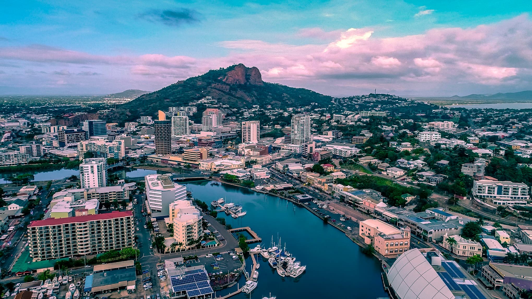 Aerial view of central Townsville, Ross Creek and Castle Hill under evening cloud