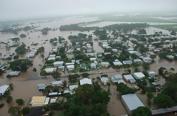 Aerial view of floodwater through houses and streets