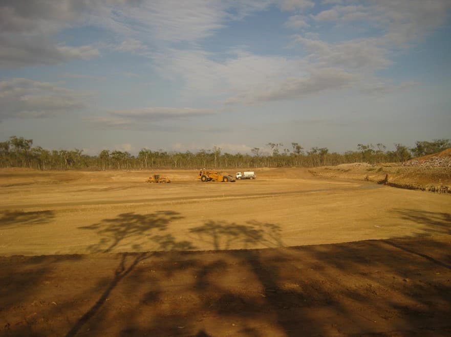 Bulk earthworks for the new waste cell at the Jensen Waste Facility, with plant working in the distance