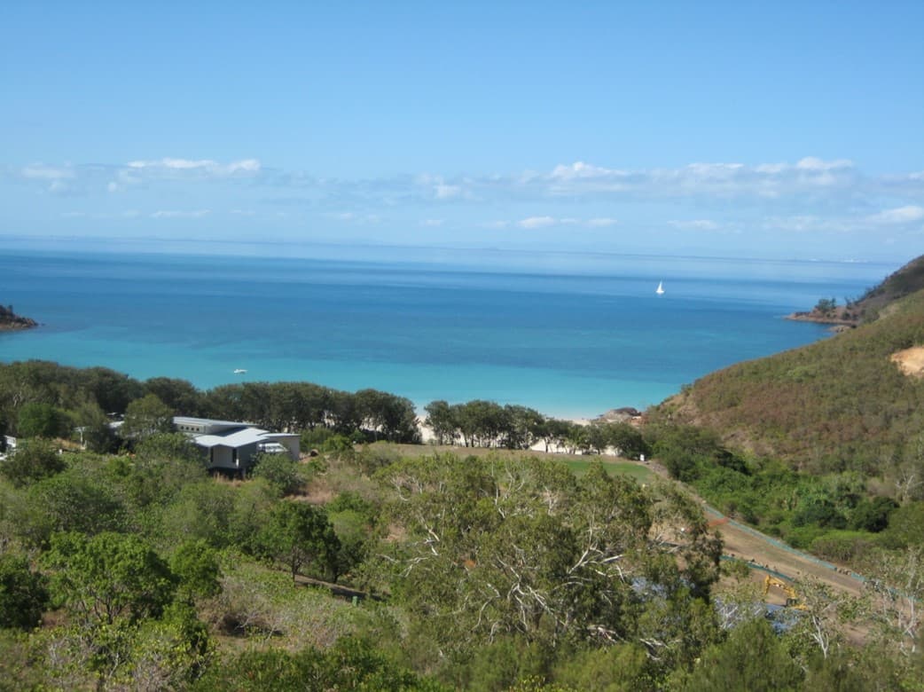 View over bushland and houses to the bay at Keswick Island