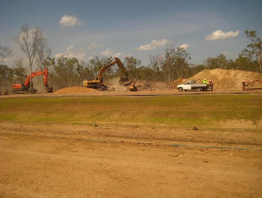 Excavators and a site vehicle on cleared earthworks at a Northern Beaches sub-division