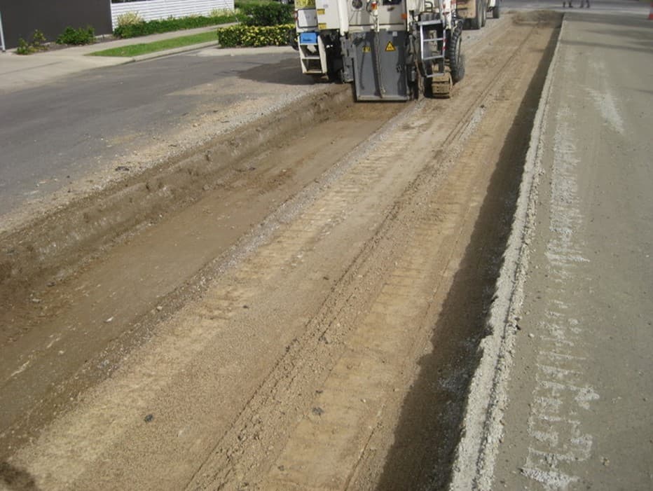 Pavement rehabilitation plant working along a suburban street